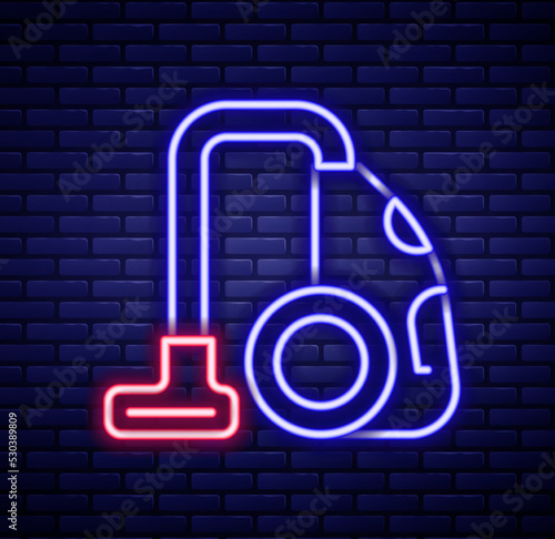 Glowing neon line Vacuum cleaner icon isolated on brick wall background. Colorful outline concept. Vector