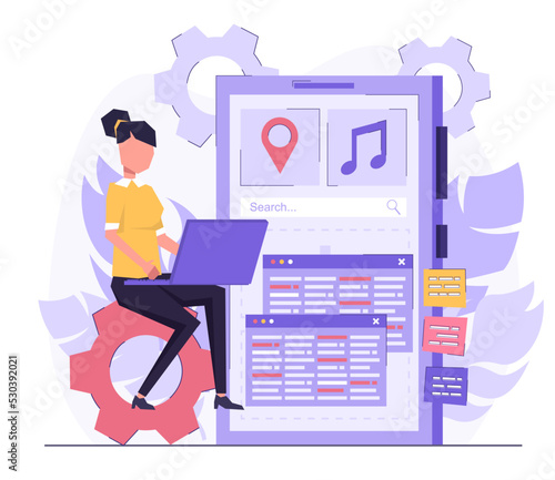 App development. A programmer developer creates an application on the phone. A woman sits on a pinion