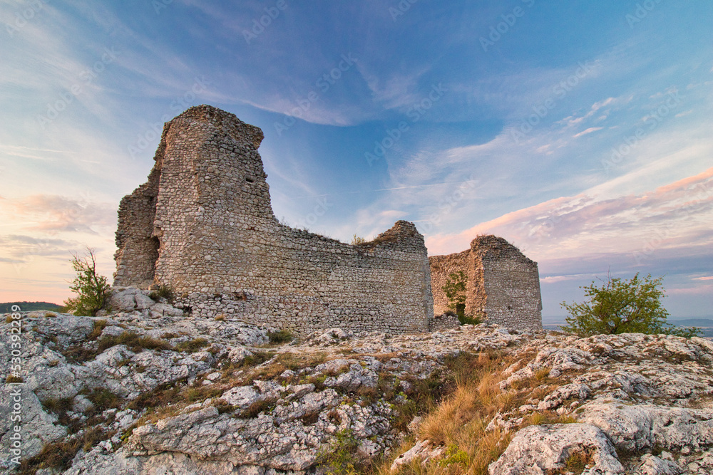 A ruin of castle Sirotci hradek in Moravia region, sunset light.