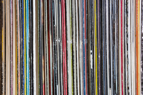 Collection of old vinyl records stacked. Detail of album cover. Concept of music.