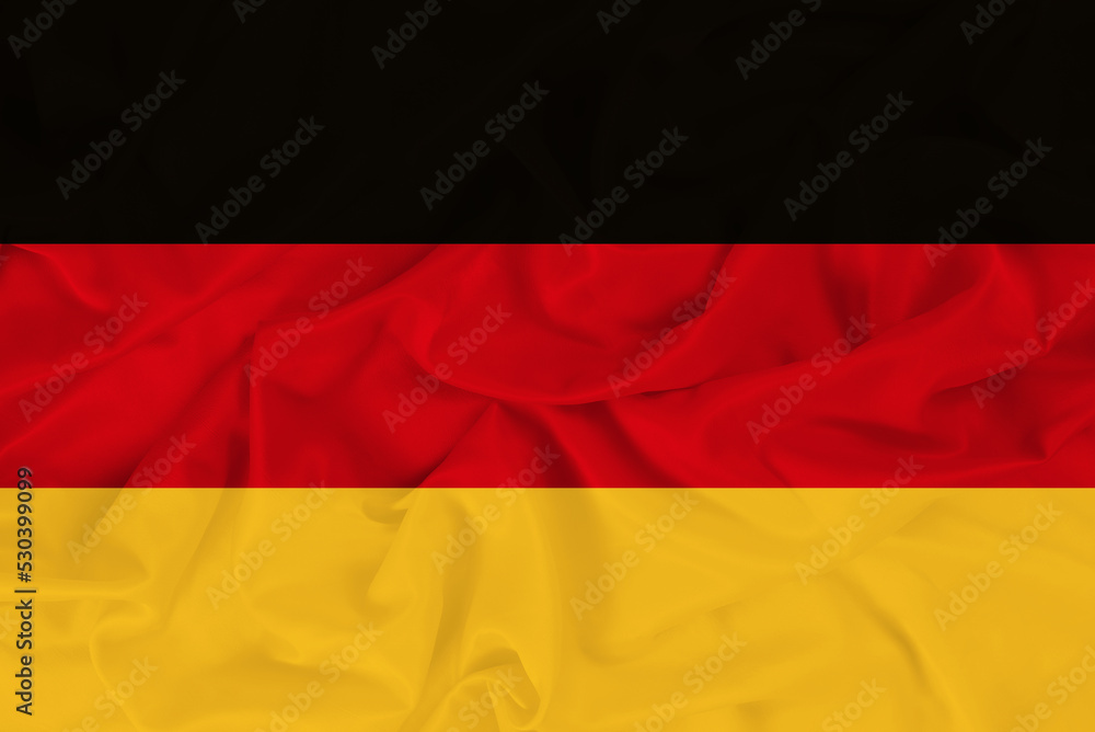 Stylish beautiful national flag of Germany on the background of wavy fabric, bright symbol-flag of Germany Stylish beautiful national flag of Germany on the background of wavy fabric, bright symbol-flag of Germany