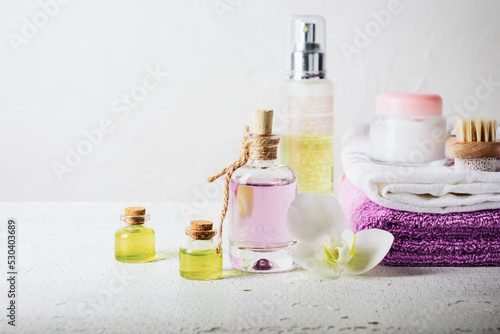 Essential oils, perfumed water in glass bottles.