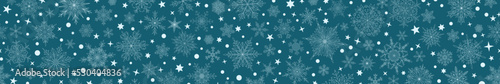 Banner of complex Christmas snowflakes in blue colors with seamless horizontal repetition. Winter background with falling snow