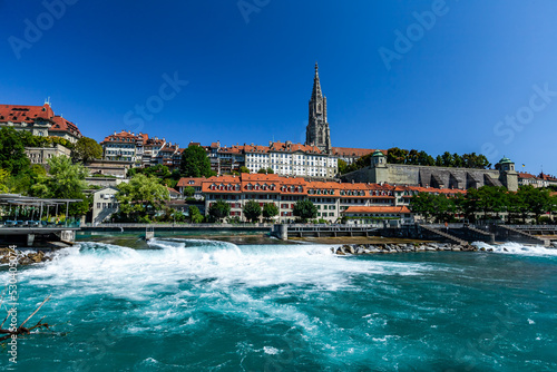 BERN, SWITZERLAND - August 8th 2022: Panoramic view of Bern and Berner Munster cathedral in a beautiful summer day, Switzerland
