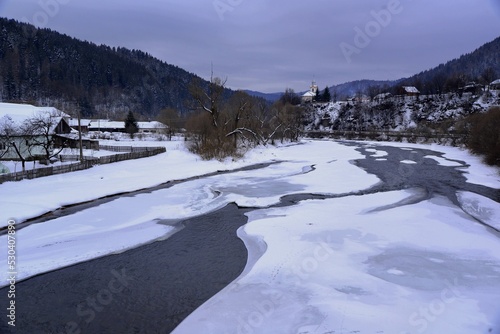 landscape with snow covered mountains and river