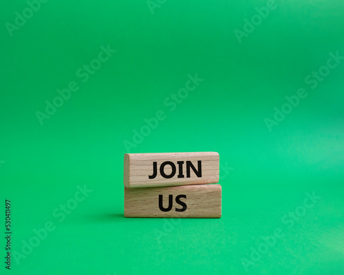 Join us symbol. Concept word Join us on wooden blocks. Beautiful green background. Business and Join us concept. Copy space