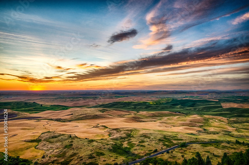 Sun setting below the horizon in a loose region of eastern Washington