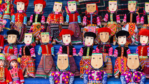 Traditional souvenirs of Vietnam. Wooden puppets in traditional clothes.