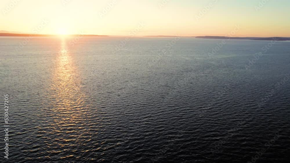 Ocean Water Aerial Background with Island Sunset on Horizon Ocean Water Aerial Background with Island Sunset on Horizon