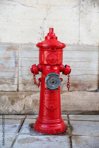 Close-up of a red fire hydrant in the city