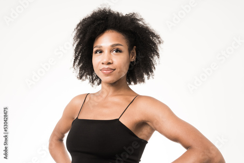 Portrait of a young woman with curly hair, clean skin face.