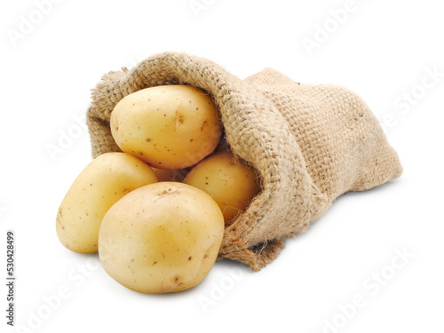 Raw potatoes in burlap sack close up isolated on white background             