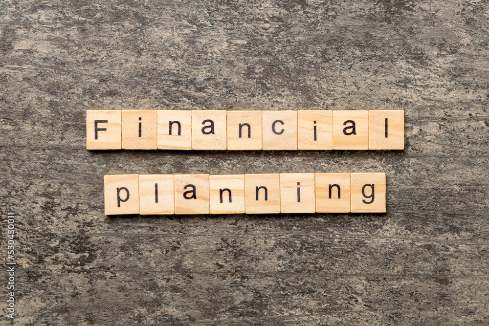 financial planning word written on wood block. financial planning text on cement table for your desing, concept financial planning word written on wood block. financial planning text on cement table for your desing, concept