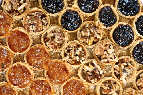 sweet Syrian nest of blueberry, almond and apricot jelly seen from above. photo