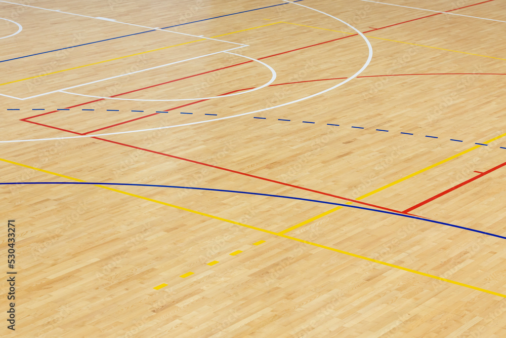 Wooden floor basketball, badminton, futsal, handball, volleyball, football, soccer court. Wooden floor of sports hall with marking lines on wooden floor indoor, gym court