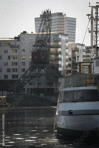 An old vessel in an urban port. 