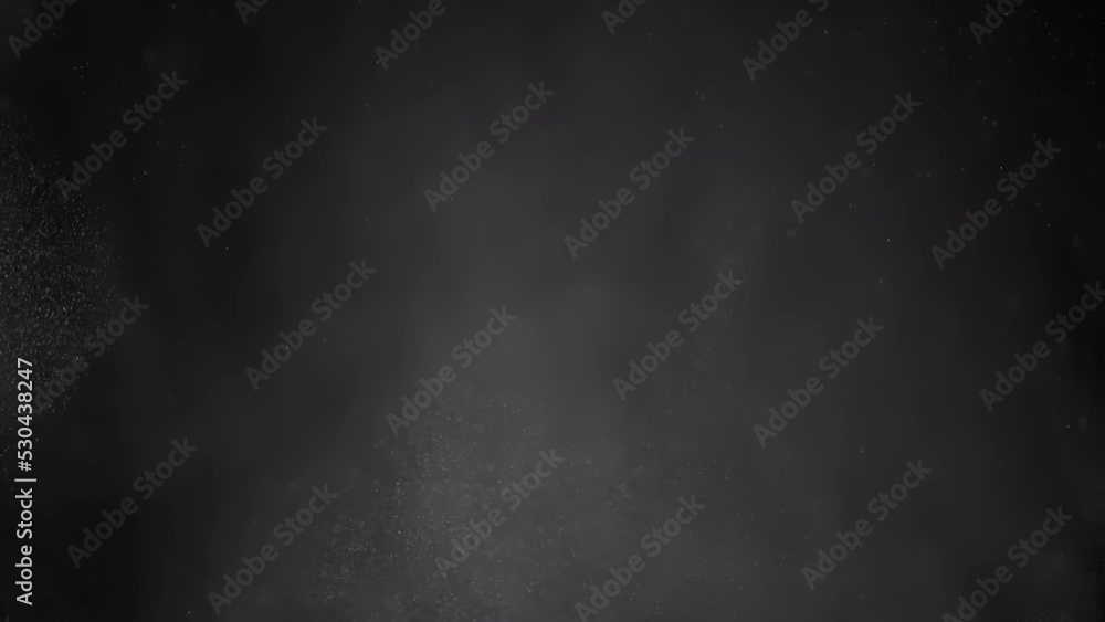 Whirlpool of Mixed Particles of Dust, Flour, Debris, Flying on Black Background. Dynamic particles of white powder, snow, flake, smoke randomly rotate, swirl, float, fall in air through space in fog. Whirlpool of Mixed Particles of Dust, Flour, Debris, Flying on Black Background. Dynamic particles of white powder, snow, flake, smoke randomly rotate, swirl, float, fall in air through space in fog.