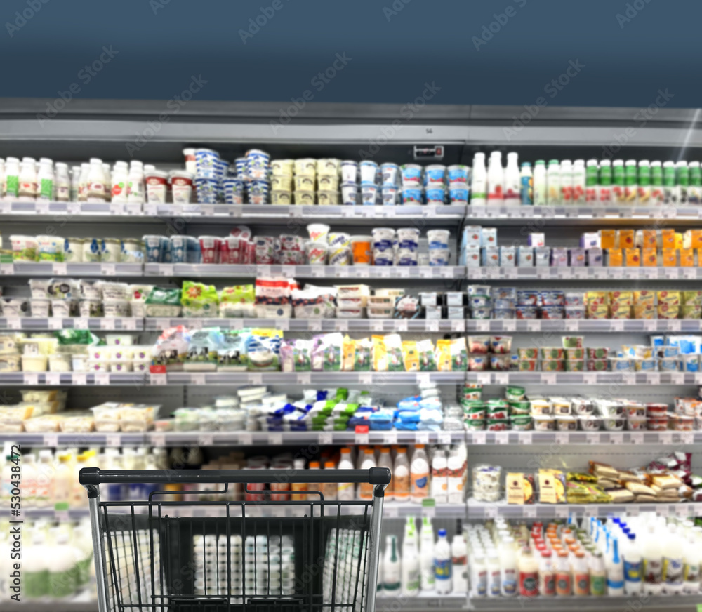 Choosing food from shelf in supermarket,vegetables in grocery section,Grocery stores ,empty grocery cart in an empty supermarket
