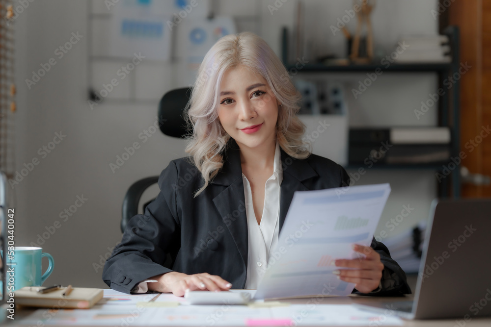 Accountant checking data document on laptop for investigation of corruption account