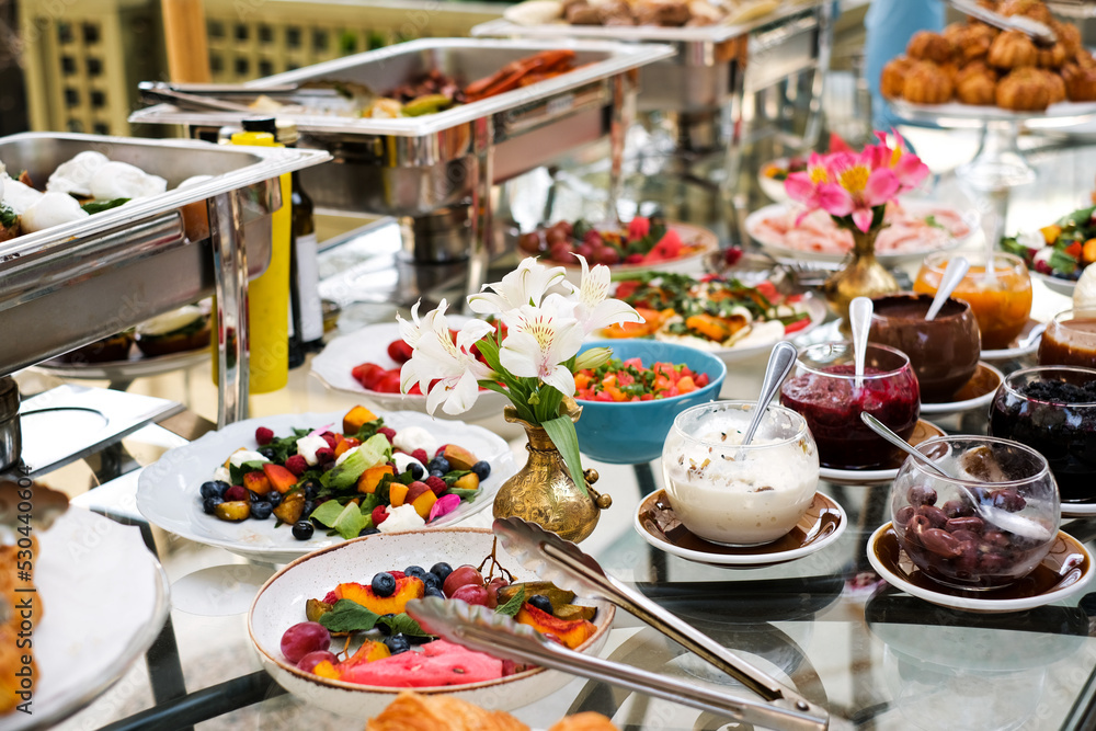 fruit salad on the buffet table with pastries