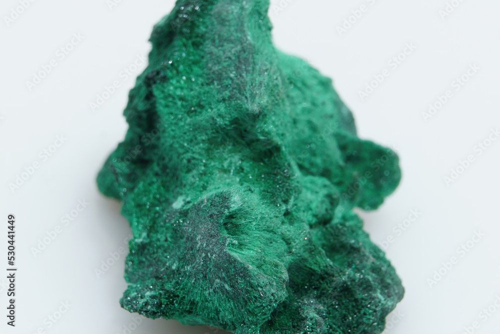 Obraz premium Natural gemstone green malachite on white background