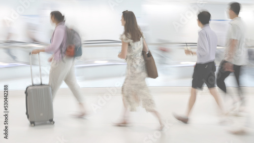 Light abstract image of people in motion with blurred background