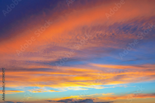 Fantastically beautiful sunset in orange-blue tones, background for design © igorgeiger