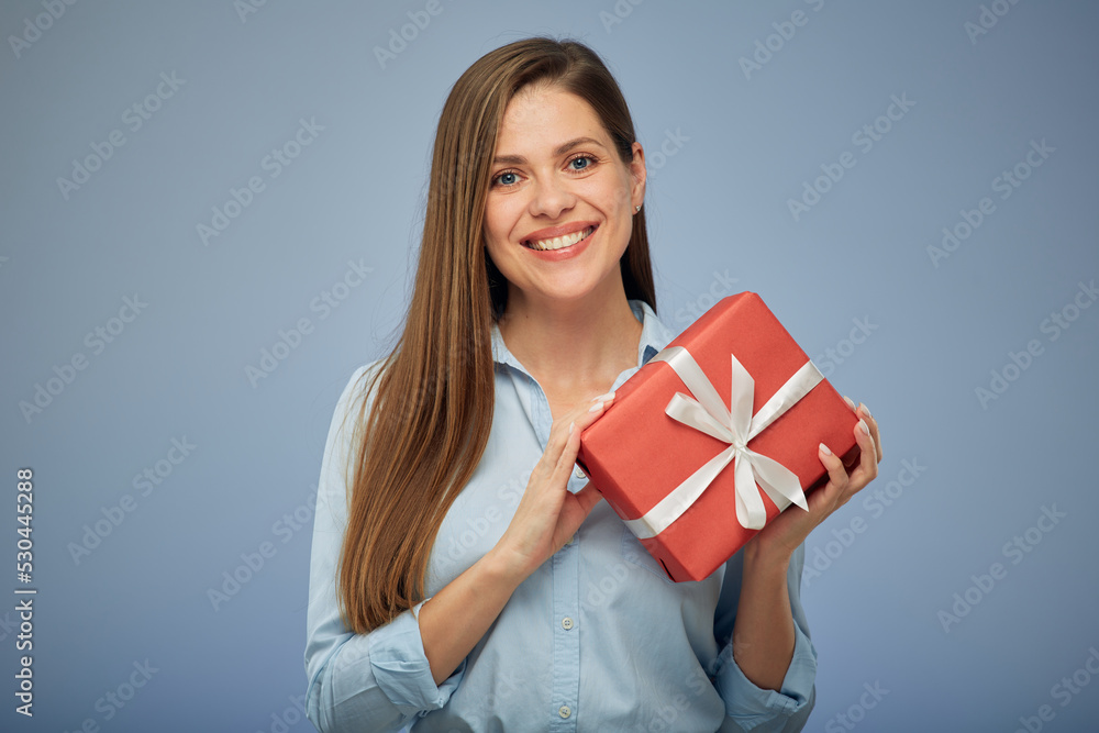 Happy woman holding gift box. Isolated female portrait. Happy woman holding gift box. Isolated female portrait.