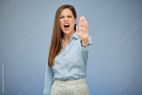 Young shouting woman gesturing stop with hands. isolated female portrait.