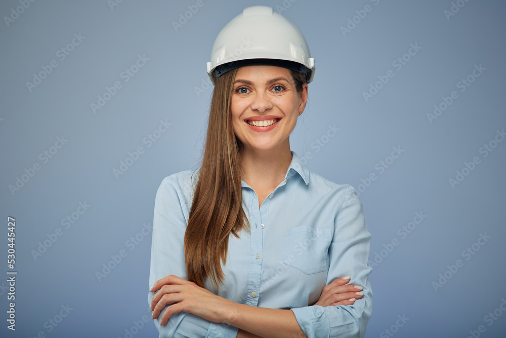 Woman architect or engineer in safety helmet standing with arms crossed. Isolated female portrait. Woman architect or engineer in safety helmet standing with arms crossed. Isolated female portrait.