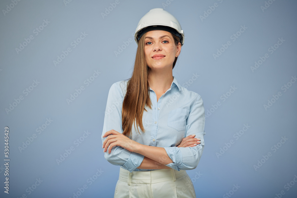 Woman architect or engineer in safety helmet standing with arms crossed. Isolated female portrait. Woman architect or engineer in safety helmet standing with arms crossed. Isolated female portrait.