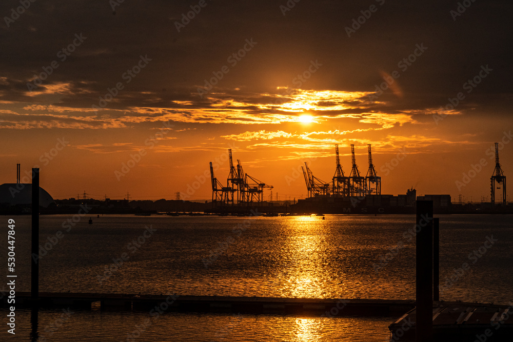 Shipping cranes at sunset in Southampton, England 