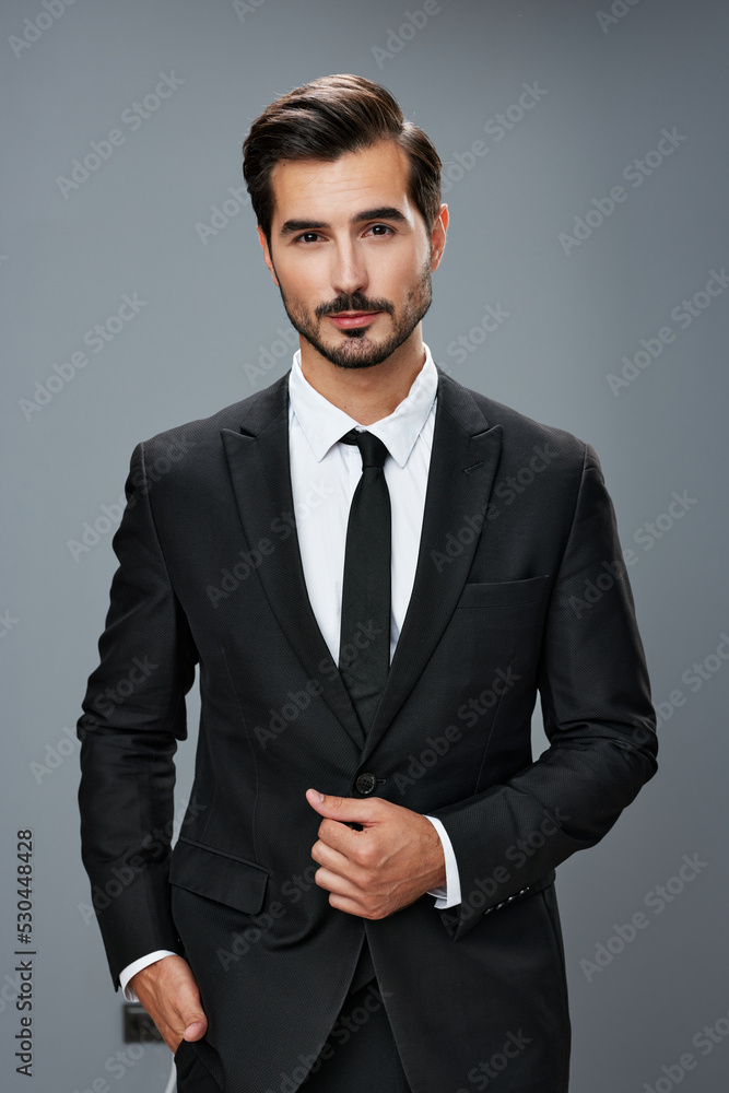 Fashion young laughing man with rose , in black suit and red pants casual  poses at studio, background floral decor wall. 5973941 Stock Photo at  Vecteezy