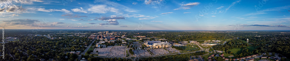 Aerial panorama of University of Kentucky campus with the football stadium parking lot on the foreground