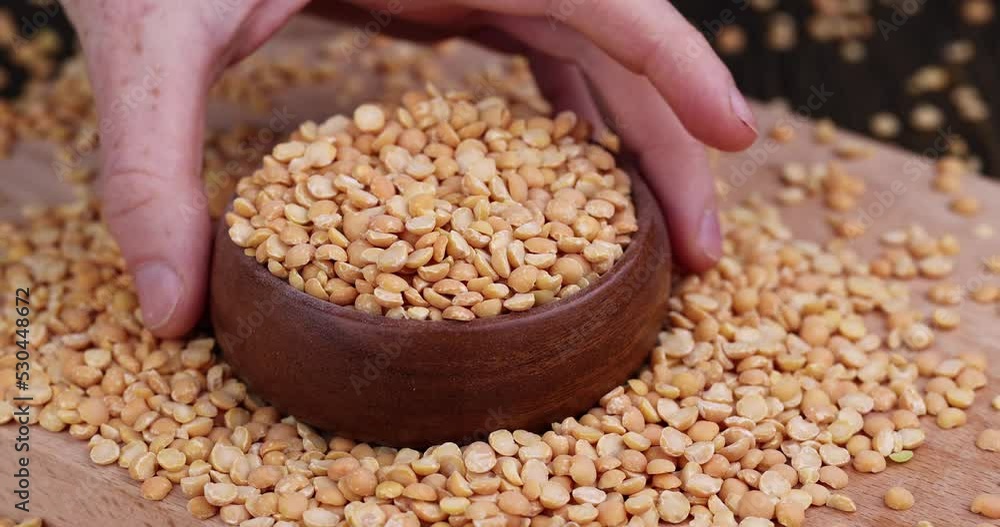 Take pea groats to the table in the kitchen, cooking dishes from traditional crushed yellow peas Take pea groats to the table in the kitchen, cooking dishes from traditional crushed yellow peas