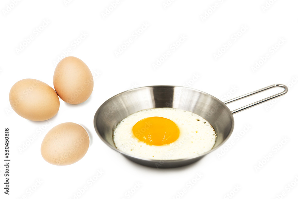 Scrambled eggs and whole raw eggs isolated on white background with clipping path. Scrambled eggs and whole raw eggs isolated on white background with clipping path.