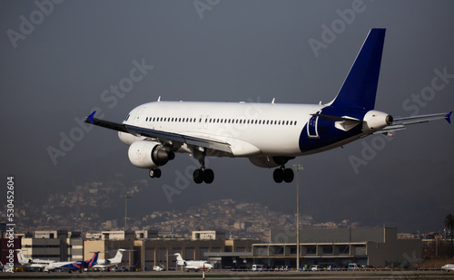 Landing passenger plane at the airport of Barcelona. Spain