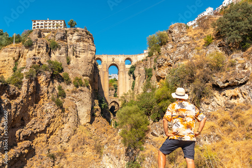 A young tourist visiting the new bridge viewpoint in Ronda province of Malaga, Andalucia