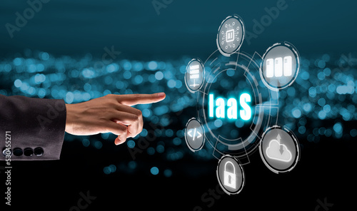 IaaS - Infrastructure as a service, Businesswoman hand touching Infrastructure as a Service icon on VR screen, networking and application platform. Internet and technology concept. photo
