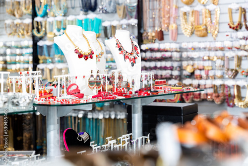 Photography Variety of necklaces, bracelets, rings and earrings on mannequins on display in