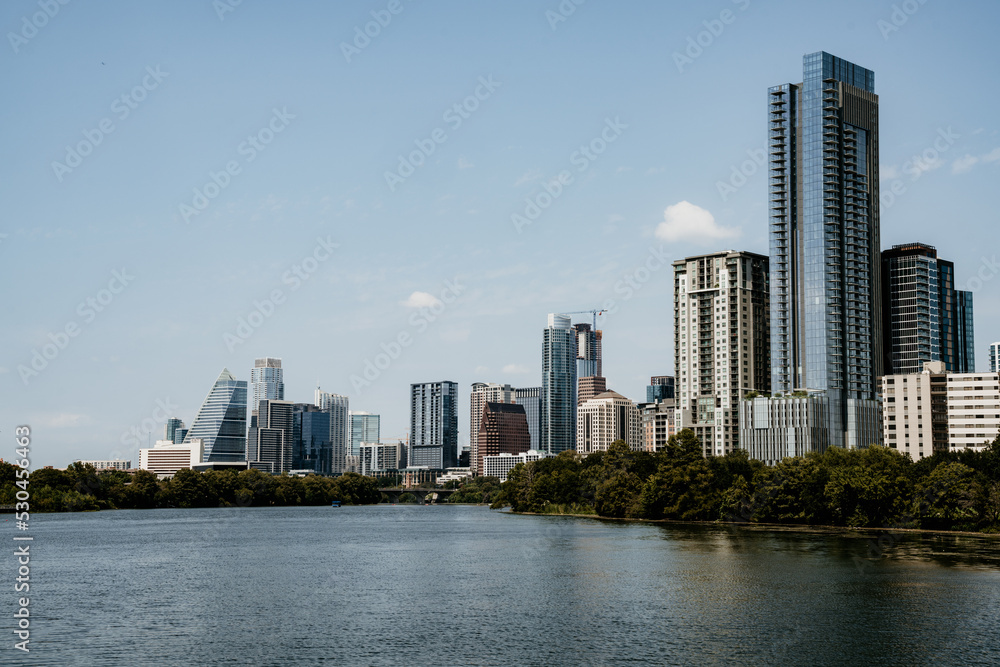 Austin city skyline view from the boardwalk with ladybird lake on a sunny day 