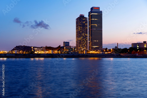 Cityscape of Barcelona's Olympic Harbour and twin towers - Torre Mapre and Hotel Arts. photo