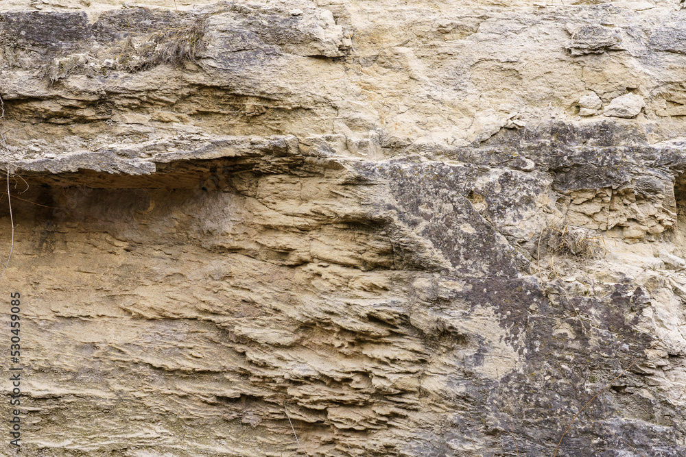 Texture cracked rock formation rock in the wild. Background with copy space Texture cracked rock formation rock in the wild. Background with copy space