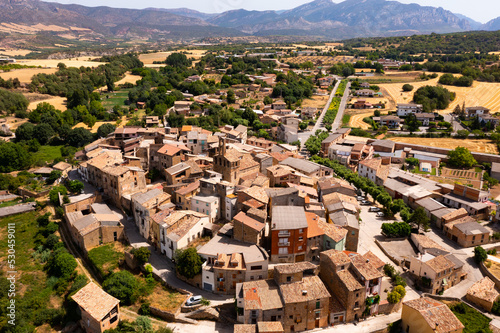 Aerial photo of Spanish town Figuerola d'Orcau, view of residential buildings with tiled roofs. photo