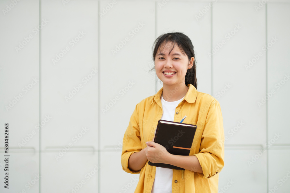Portrait of confident woman arms crossed smiling at camera. Portrait of confident woman arms crossed smiling at camera.