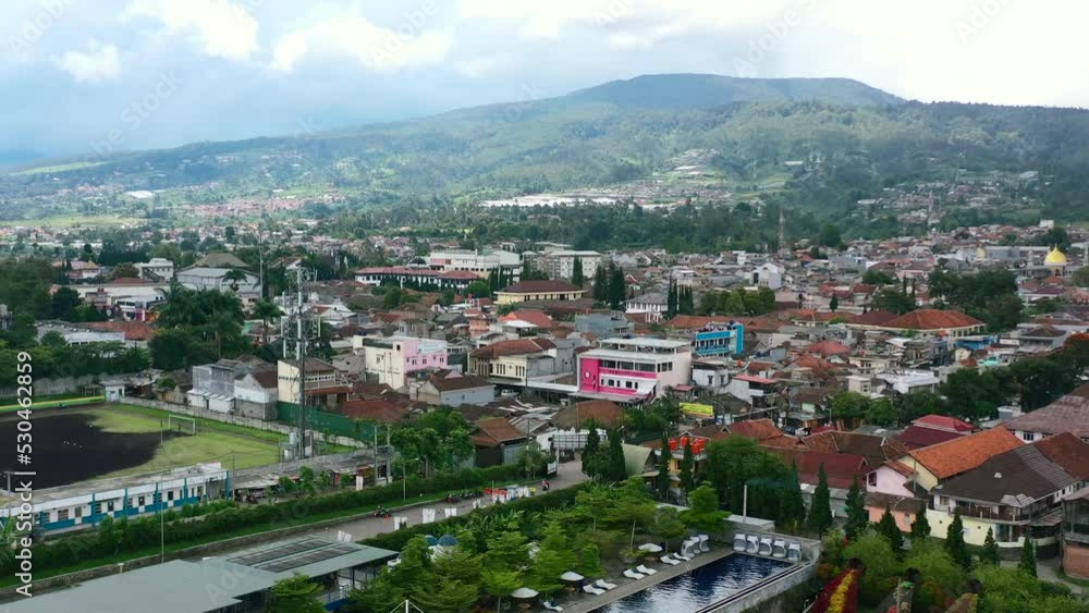aerial cityscape skyline of buildings and mountain in Bandung Indonesia on sunny day aerial cityscape skyline of buildings and mountain in Bandung Indonesia on sunny day
