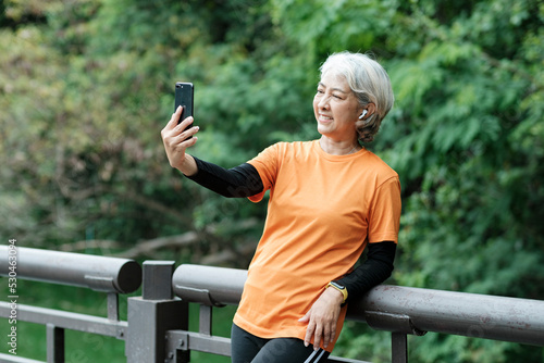 Happy senior woman taking selfie photo.