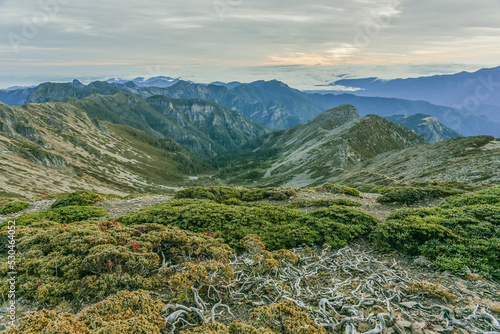 Panoramic View Of The Holy Ridge And Glacial Cirque At Sunrise On The Trail To Main Peak Of Xue Mountain (Snow mountain) , Shei-Pa National Park, Taiwan photo