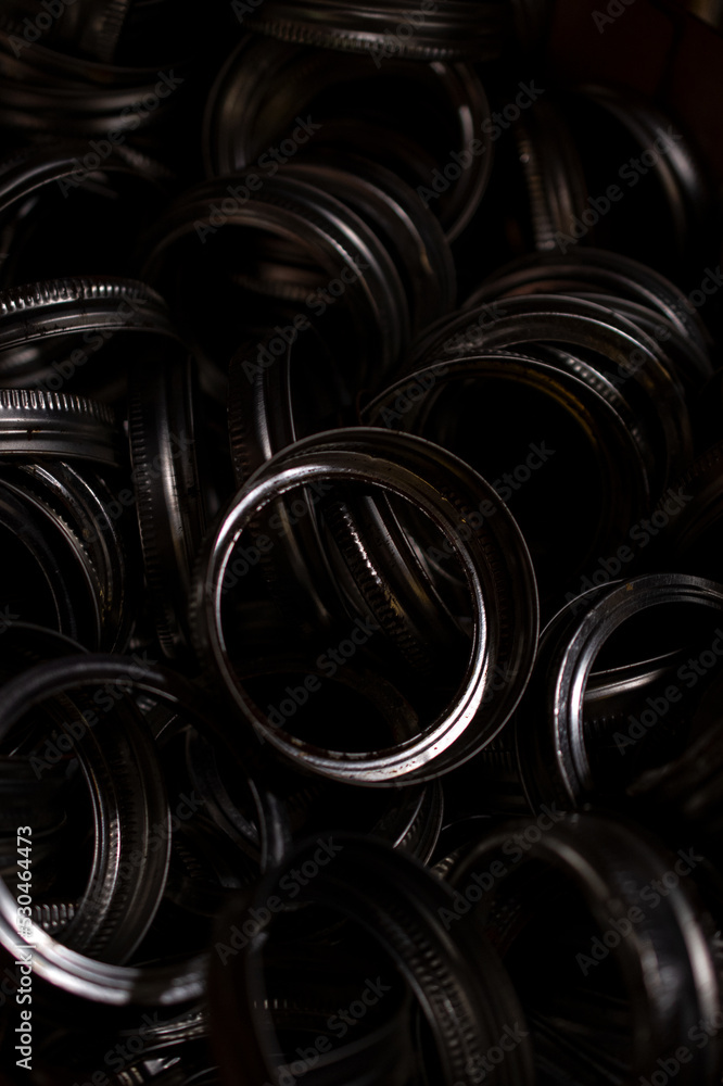 Obraz premium Pile of steel lids 