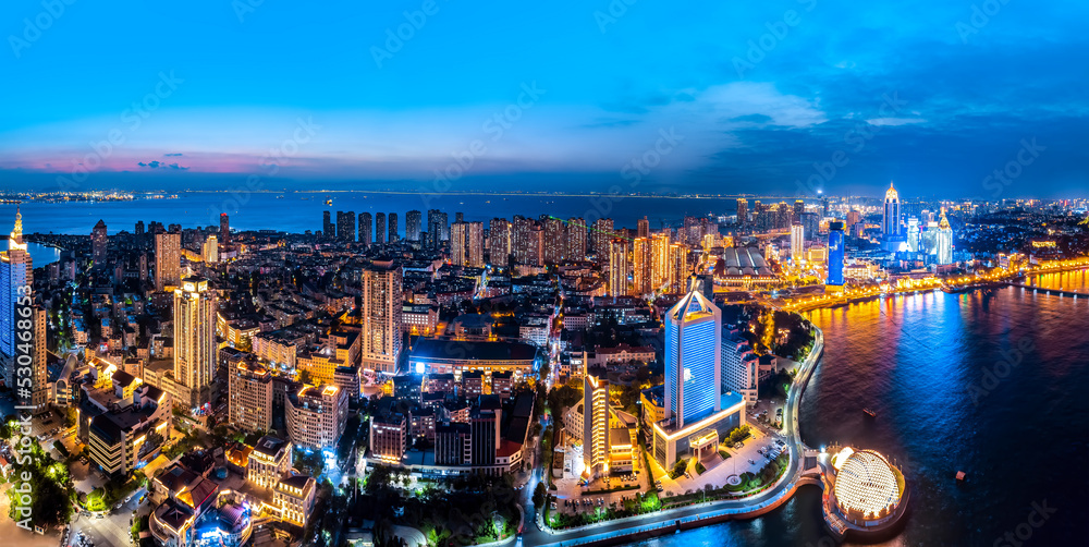 Aerial photography night view of modern city buildings in Qingdao, China